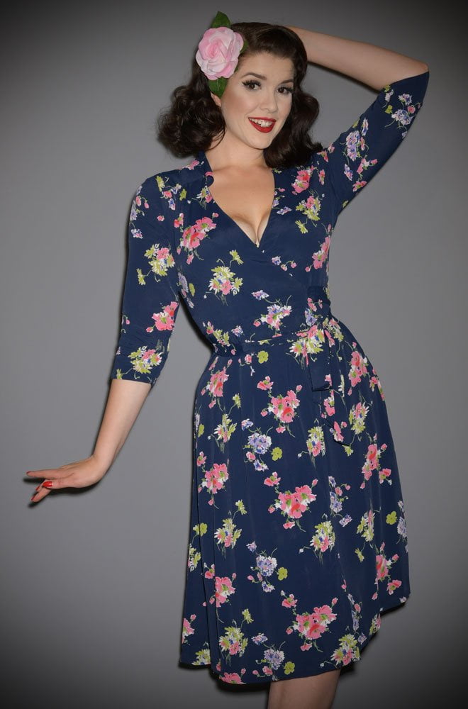 The Loretta Wrap Dress is a classic 1940's wrap dress with 3/4 length sleeves in a striking navy floral print at Deadly is the Female.