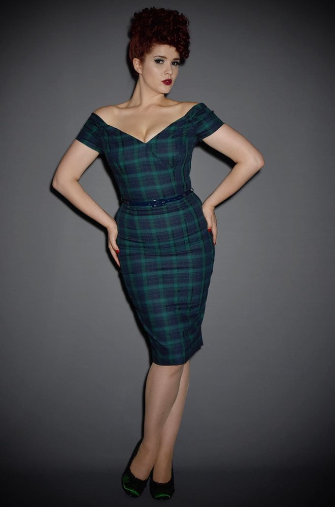 The Fatale tartan wiggle dress in forest and navy is a real bombshell of a dress. This fabulous off the shoulder wiggle dress is perfect for pinup girls.
