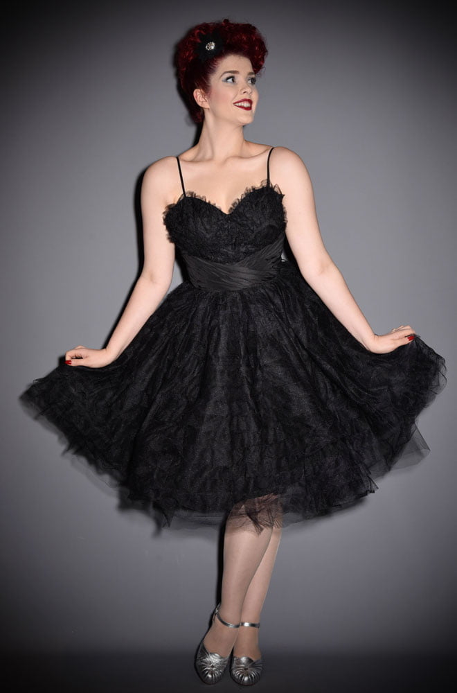 The Sweetheart Cupcake dress is a stunning vintage reproduction cocktail dress. This little black dress is rich in 1950s vintage appeal. By Unique Vintage.