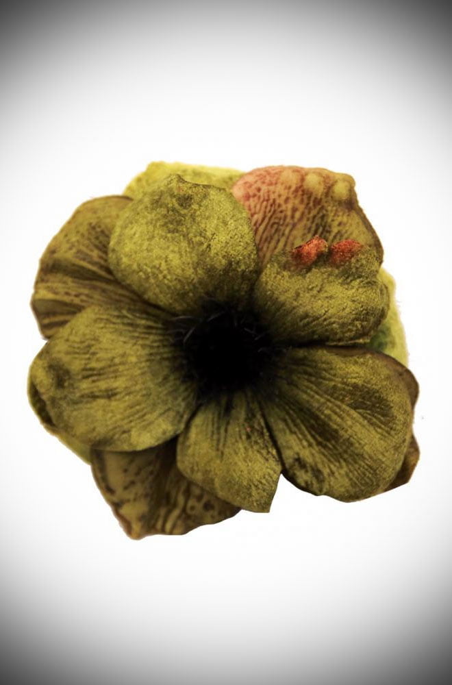 The Olive Anemone Hair Clip is a remarkably detailed flower with delicate petals made of velvet. This stunning piece has been carefully handmade.