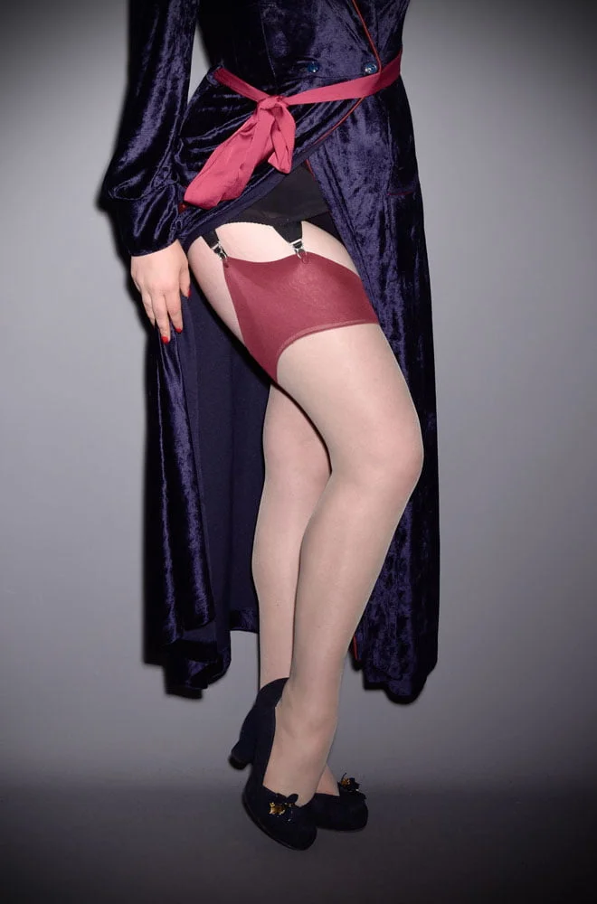 The Claret Glamour Seamed Stockings are elegant champagne nylons with a claret red seam. They add a little bit of glamour to any outfit.