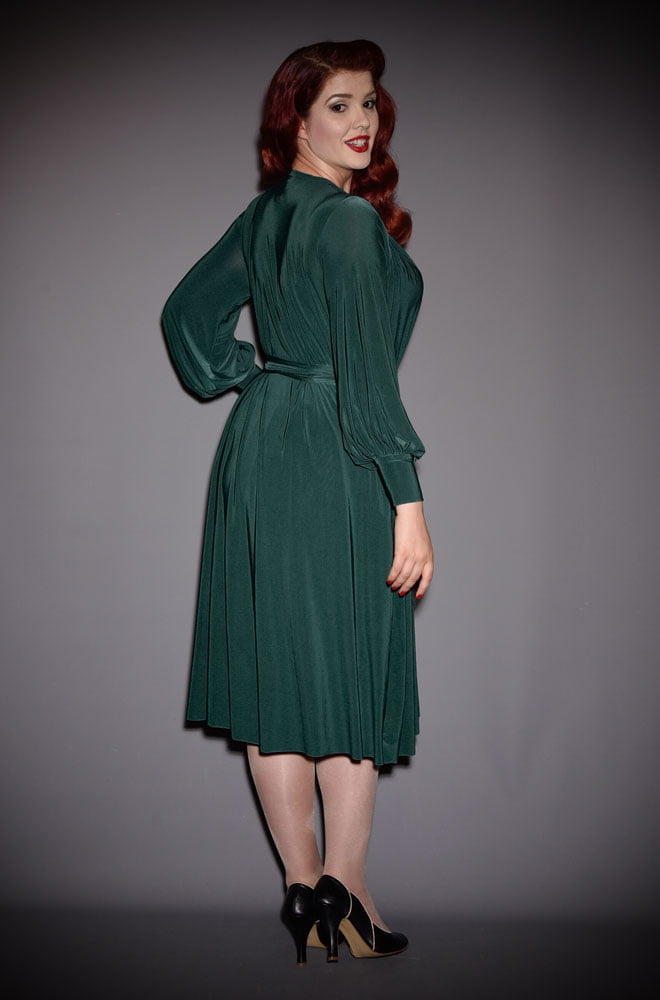 The Green Claudia Dress is a draped jersey dress with sash waist & bishop sleeves. A signature piece by Alexandra King for Deadly is the Female.