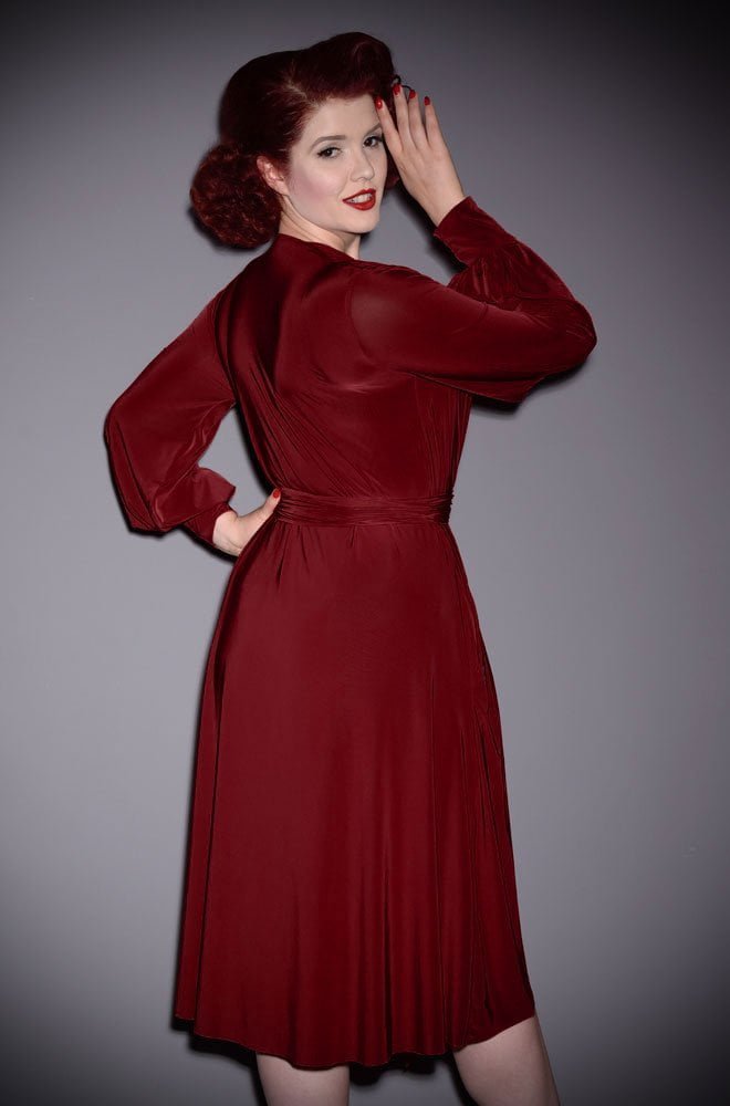 The Burgundy Claudia Dress is a draped jersey dress with sash waist & bishop sleeves. A signature piece by Alexandra King for Deadly is the Female.