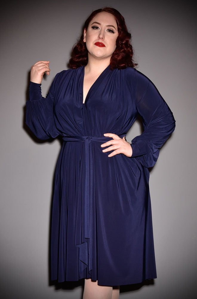 The Navy Claudia Dress is a draped jersey dress with sash waist & bishop sleeves. A signature piece by Alexandra King for Deadly is the Female.