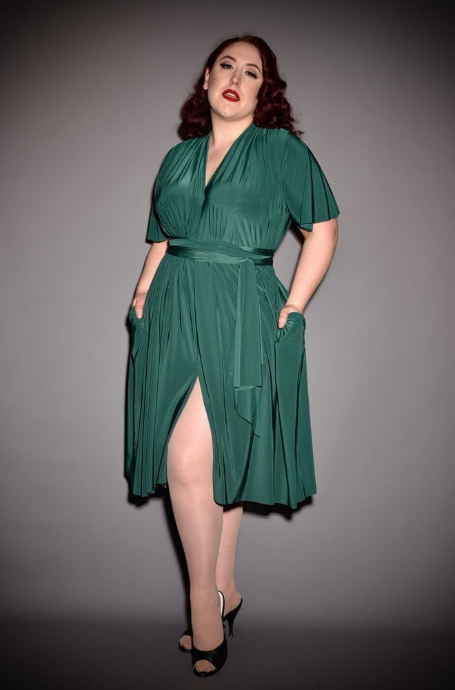 The Green Flutter Sleeve Claudia Dress is a draped dress with sash waist. A signature piece for the Alexandra King for Deadly is the Female Collection.