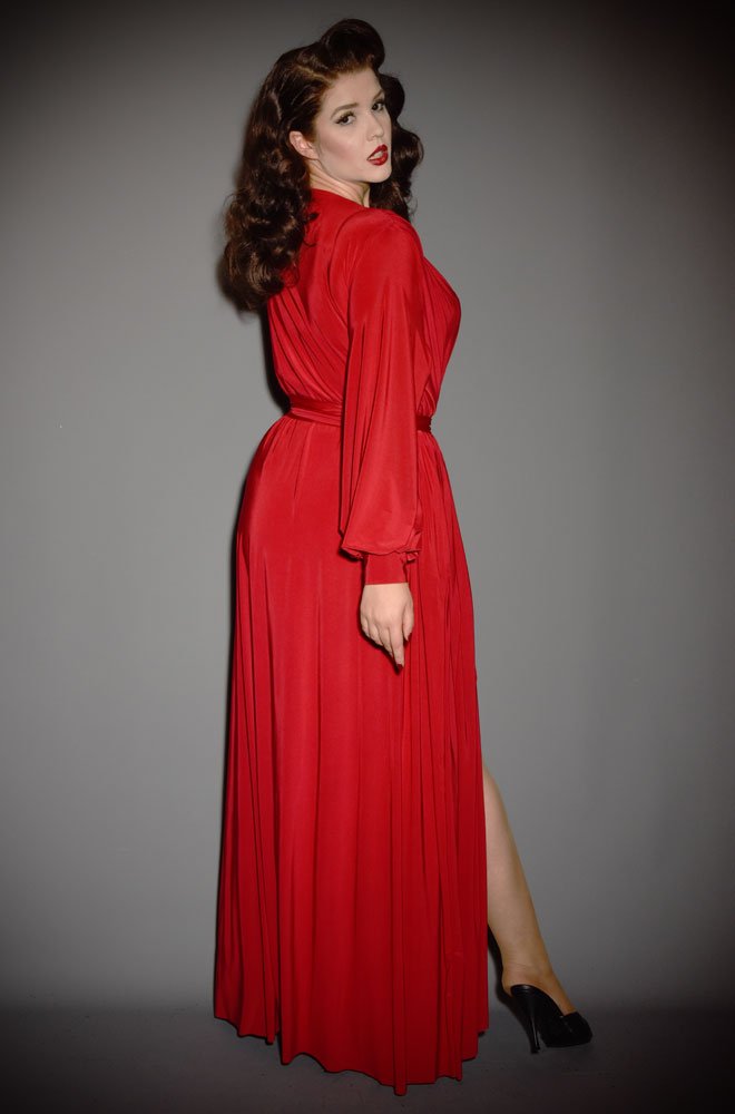 The Red Claudia Gown is a draped jersey evening dress with bishop sleeves. A signature piece by Alexandra King for Deadly is the Female.