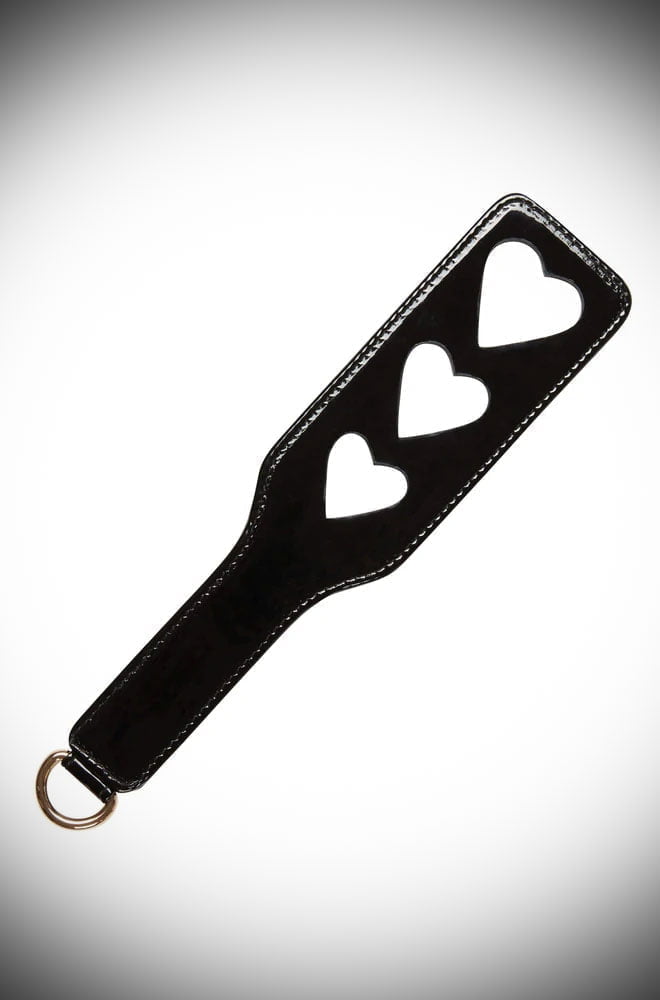 With heart-shaped cut-outs and a luxurious smooth finish, this Black Heart Spanking Paddle is bound to leave a loving mark or two.