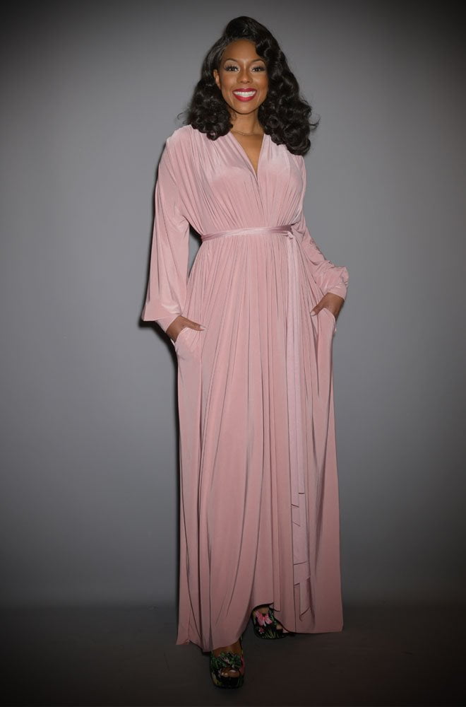 The Dusty Rose Claudia Gown is a draped jersey evening dress with sash waist & bishop sleeves. A signature piece by Alexandra King for Deadly is the Female.