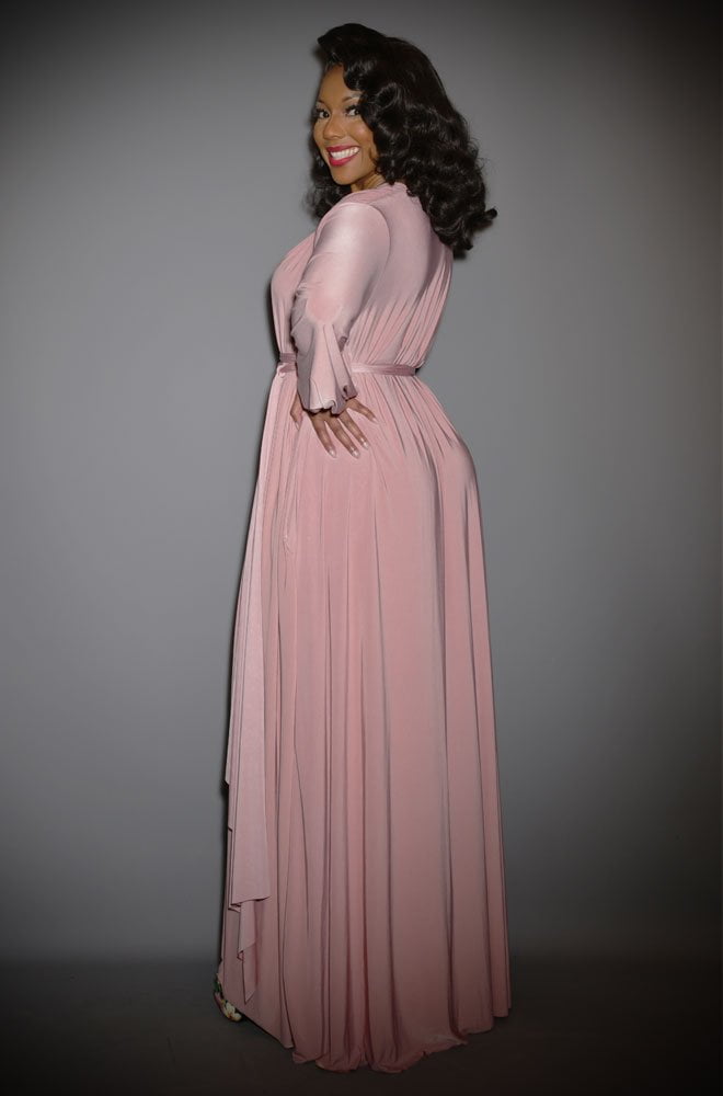 The Dusty Rose Claudia Gown is a draped jersey evening dress with sash waist & bishop sleeves. A signature piece by Alexandra King for Deadly is the Female.