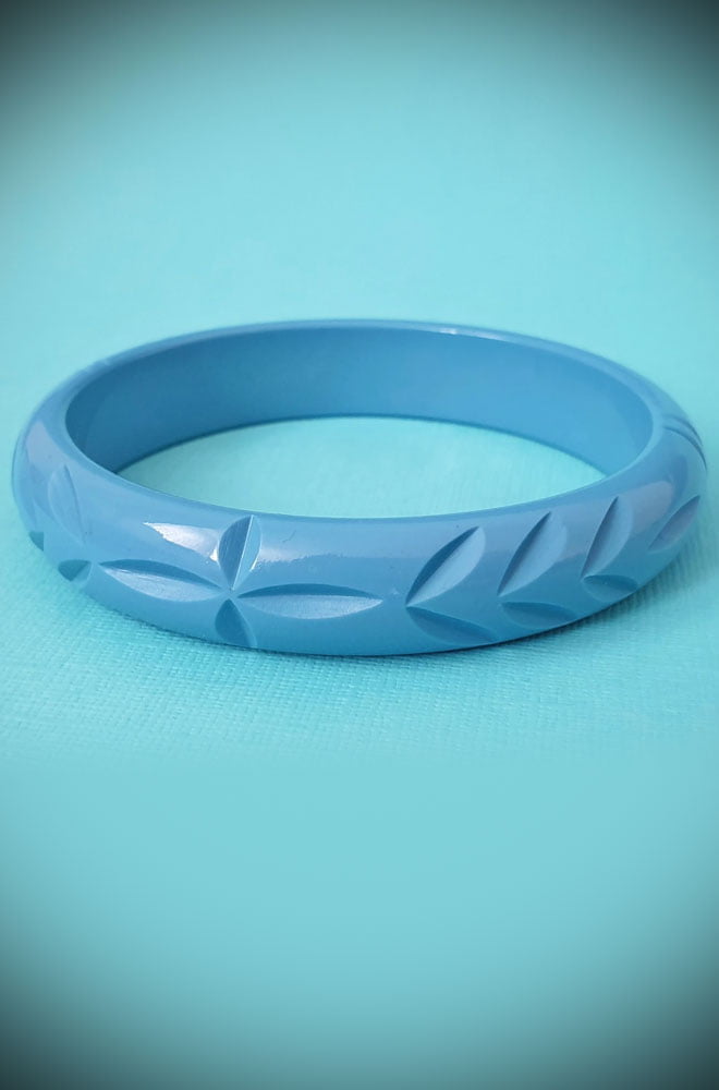 Based on vintage designs for an authentic look, the carved fakelite Elsie bangle in Dusty Blue! Coordinating seamlessly with the Elsie hoops.