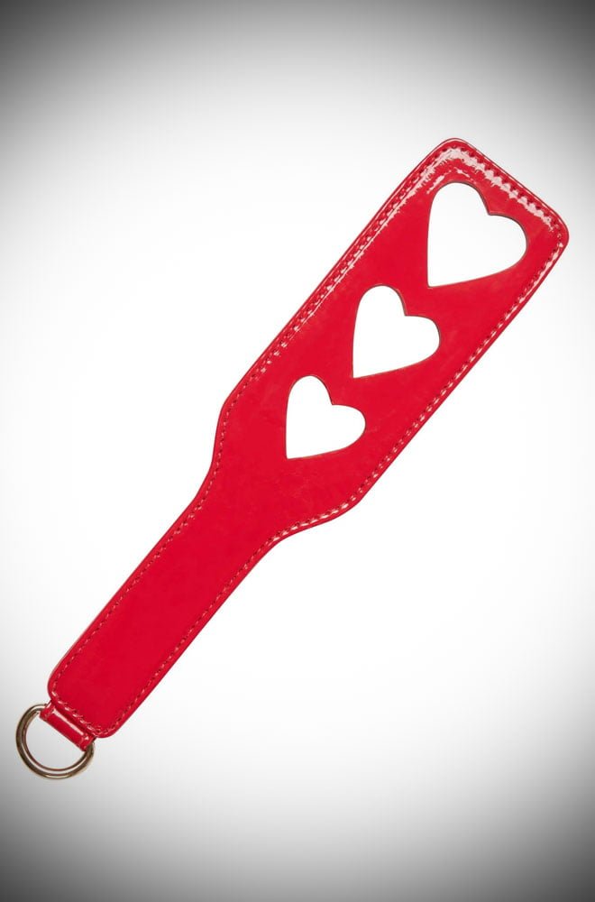 With heart-shaped cut-outs and a luxurious smooth finish, this Red Heart Spanking Paddle is bound to leave a loving mark or two.