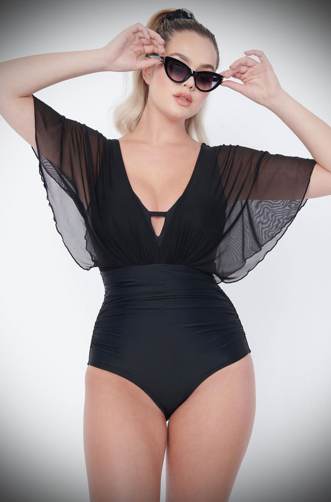 The Torrey Swimsuit is a sultry and bewitching retro swimsuit with mesh sleeves. Turn heads in this vintage-inspired swimming costume!