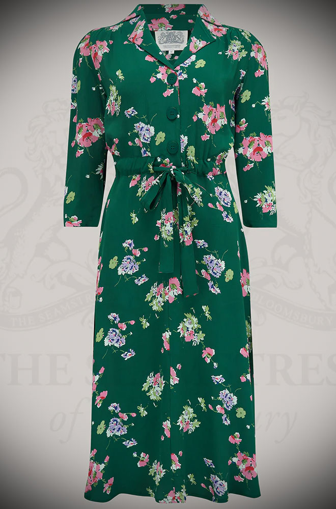 The Mayflower Milly Dress is a classic 40s inspired dress in a floral print. Elegant and chic, this understated dress also has a sultry feel.