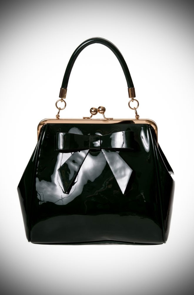 The Black Vintage Style Handbag is a chic patent faux leather handbag. Classic and timeless, this stylish bag is an essential finishing touch