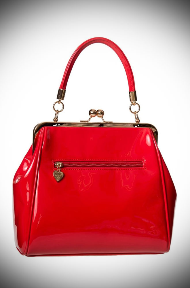 The Red Vintage Style Handbag is a chic patent faux leather handbag. Classic and timeless, this stylish bag is an essential finishing touch