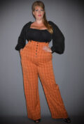 The Pumpkin Spice Thelma Trousers are timeless high-waisted, wide-legged Trousers. We adore the Thirties feel of these. UK stockists of Unique Vintage.