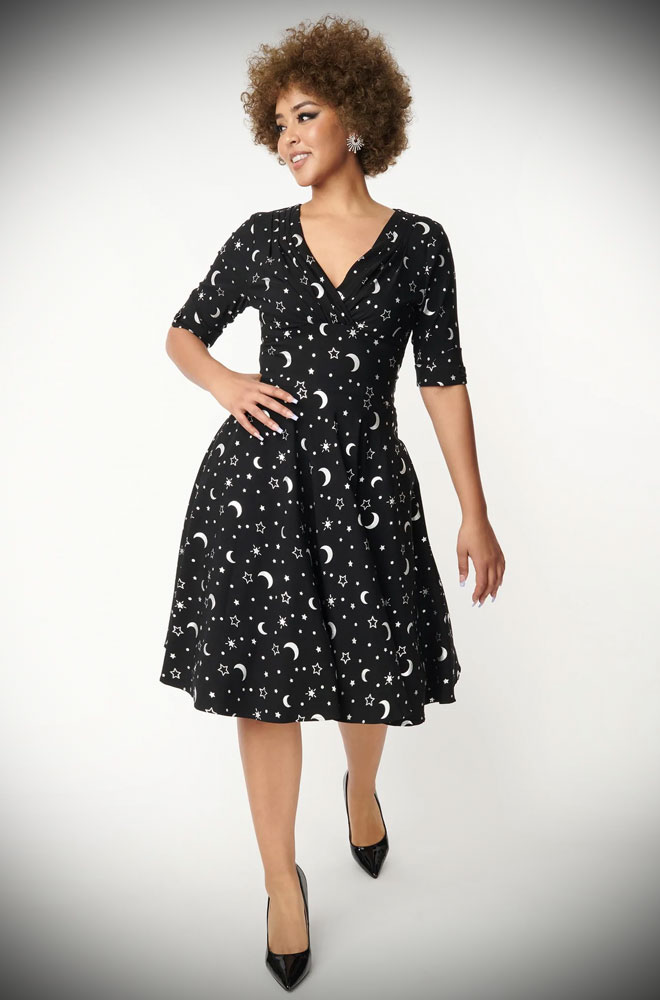The Galaxy Print Delores Dress is an effortlessly elegant 50s style dress. The perfect dress for turning heads this winter.