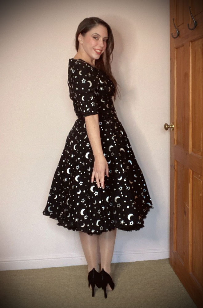 The Galaxy Print Delores Dress is an effortlessly elegant 50s style dress. The perfect dress for turning heads this winter.