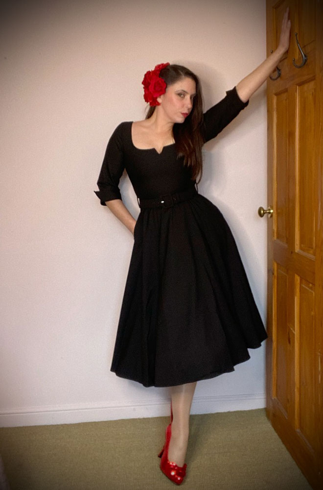 The Paige Swing Dress is a beautiful fit and flare dress, in timeless black. Pair with a fitted cardigan and boots in colder months.