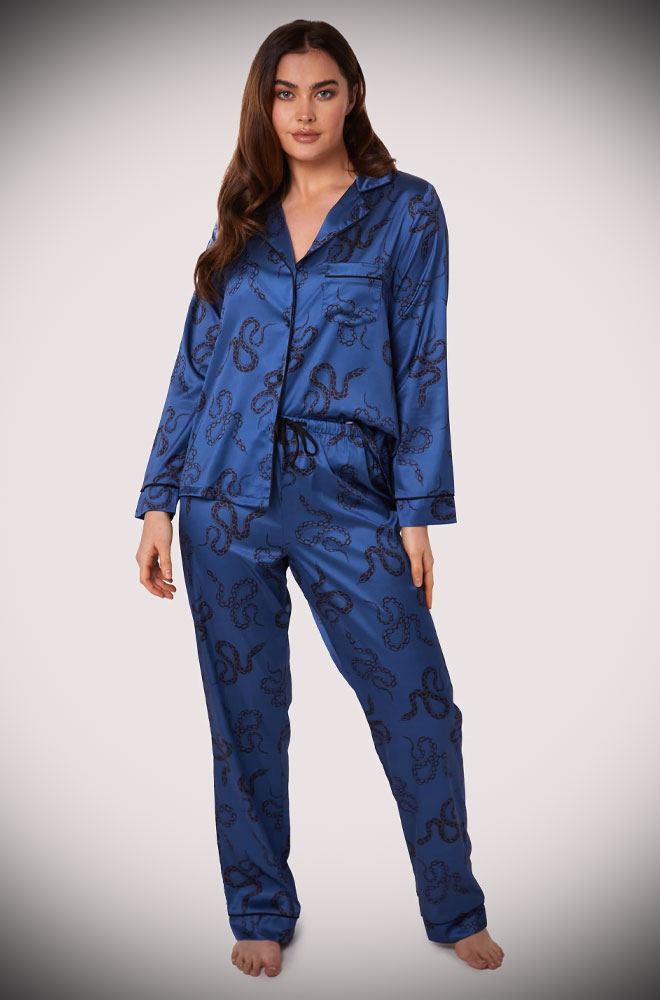 Long sleeve, button-up shirt & wide leg trouser style blue Satin Snake Pyjama Set. Featuring black snakes dancing across a soft, rich blue satin.