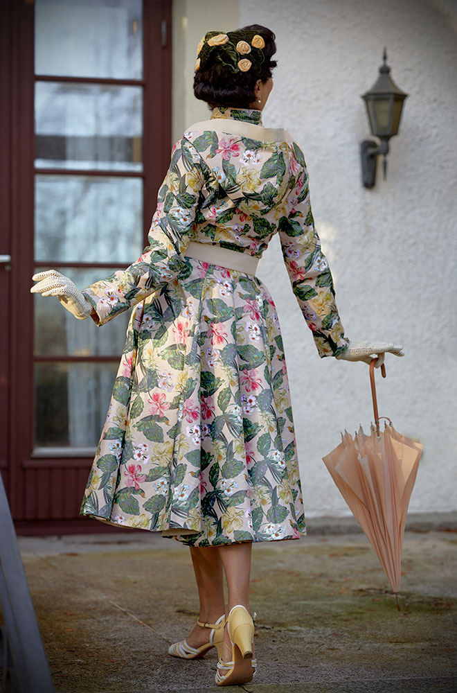 Laina-Cream Water Repellent Swing Coat - a stunning 1950’s floral reversible coat with a detachable hood. Deadly are Miss Candyfloss UK stockists.