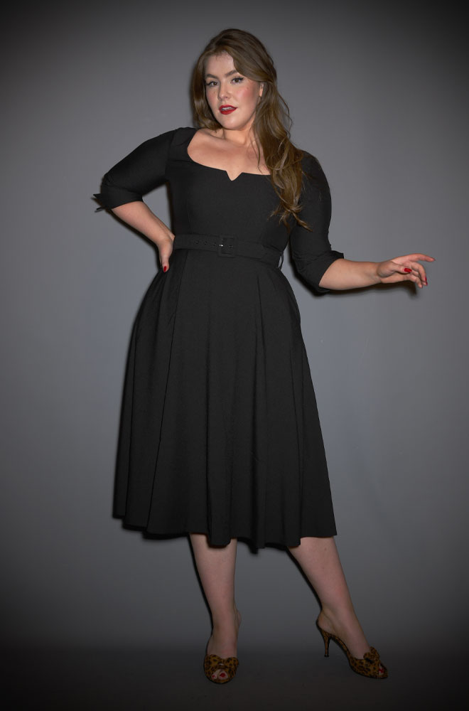 The Paige Swing Dress is a beautiful fit and flare dress, in timeless black. Pair with a fitted cardigan and boots in colder months.