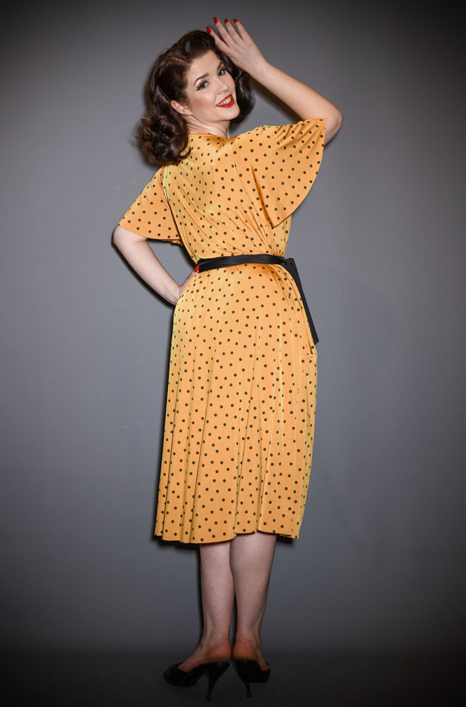 The Yellow Polka Flutter Sleeve Claudia Dress - One Size fits most draped dress. A signature piece for the Alexandra King for Deadly is the Female