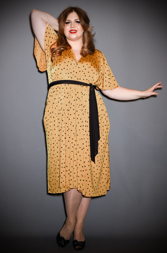 The Yellow Polka Flutter Sleeve Claudia Dress - One Size fits most draped dress. A signature piece for the Alexandra King for Deadly is the Female