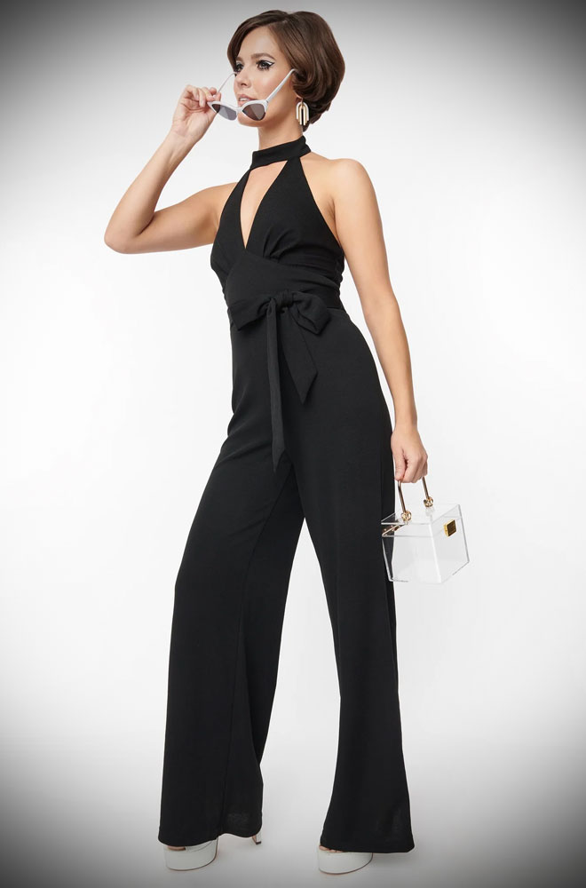Black Glamour Goddess Jumpsuit, full of sass and class. A 1960s retro style wide-leg jumpsuit in timeless black. UK stockists of Unique Vintage.