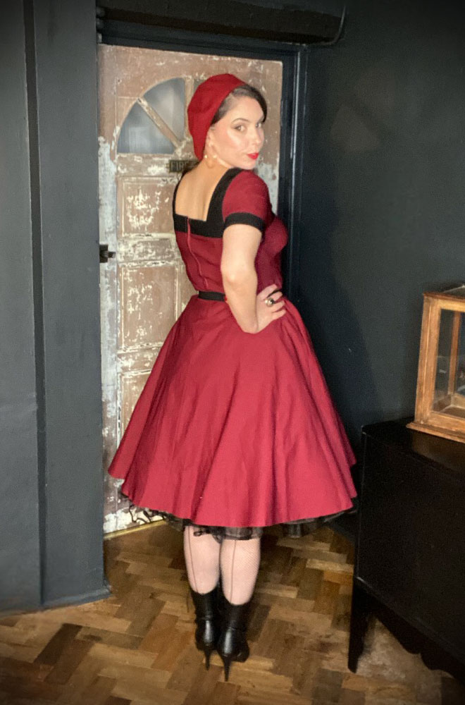 The Burgundy Clara Swing Dress is an effortlessly elegant 50s-style dress. Deadly is the Female are K stockists of Unique Vintage.
