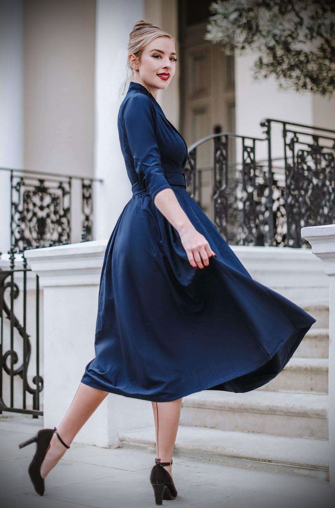 The Catherine Swing Dress is a beautiful fit and flare dress, in timeless navy blue. Pair with a fitted cardigan and boots in colder months.