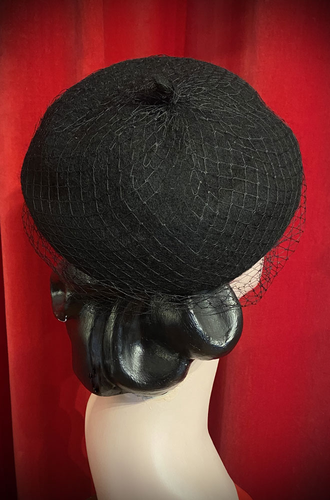 The Black Widow Veiled Beret is a wool-style beret with net detail. Perfect for femme fatales and pinup girls. Vintage style glamour with no effort!