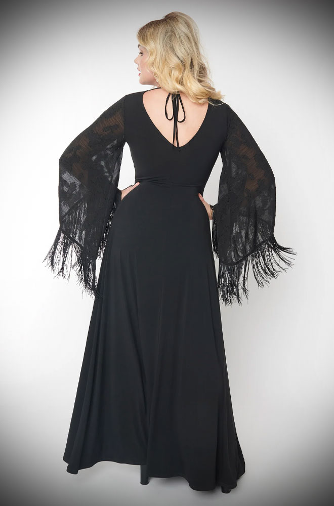 The Black Fringe Stevie Dress is a 70s-style dress in black jersey with stunning statement sleeves, trimmed in fringe. Chic, comfortable and fun.
