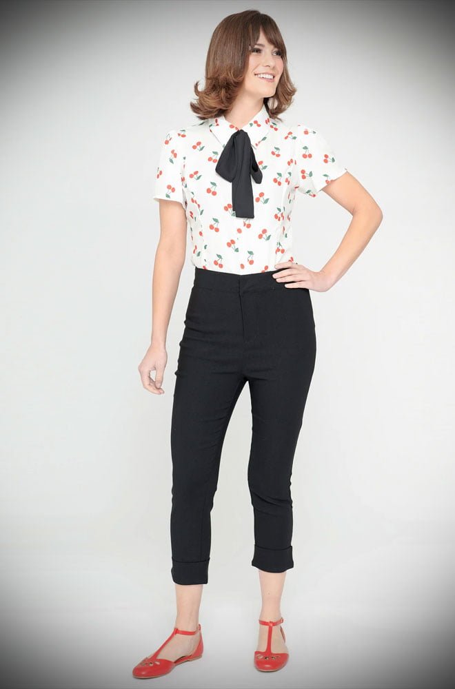 Cherry Pocket Capris are cut in a black stretch blend that hugs your curves, while the high waist is nipped in. UK stockists of Unique Vintage.