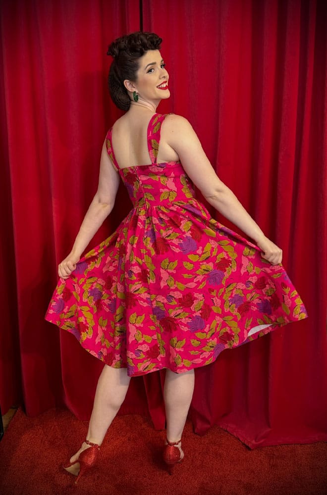 The Anna 1950s Floral Swing Dress is a darling 50s-style summer dress in a sassy floral print. Perfect with a petticoat, ideal for weddings.