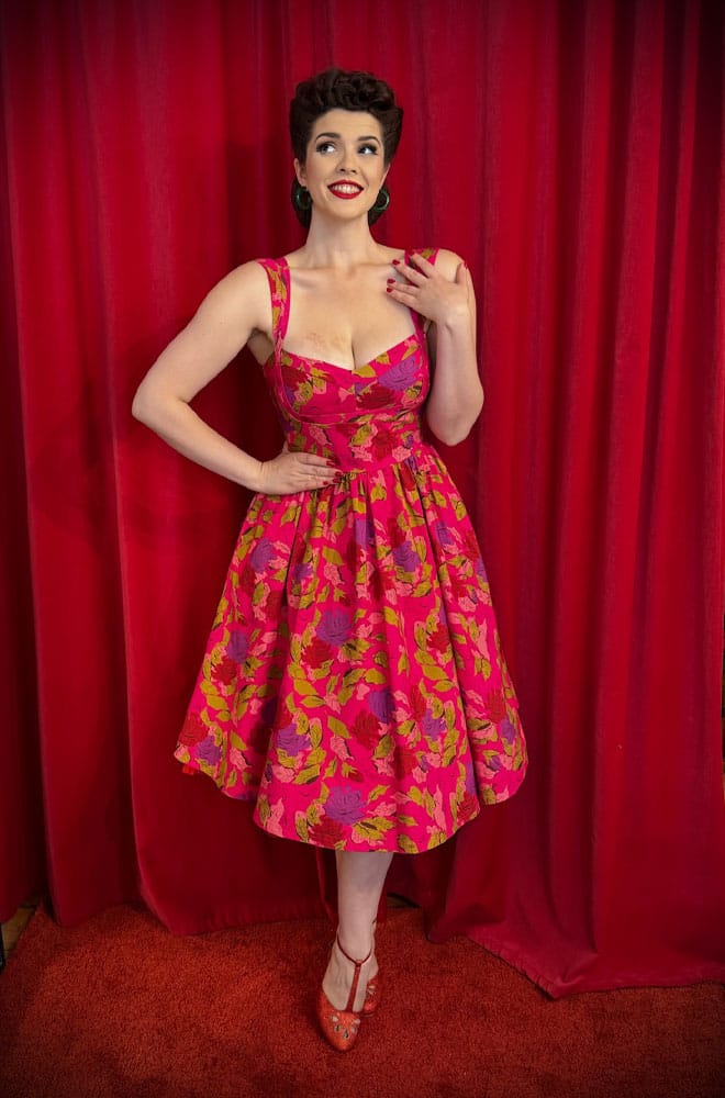 The Anna 1950s Floral Swing Dress is a darling 50s-style summer dress in a sassy floral print. Perfect with a petticoat, ideal for weddings.