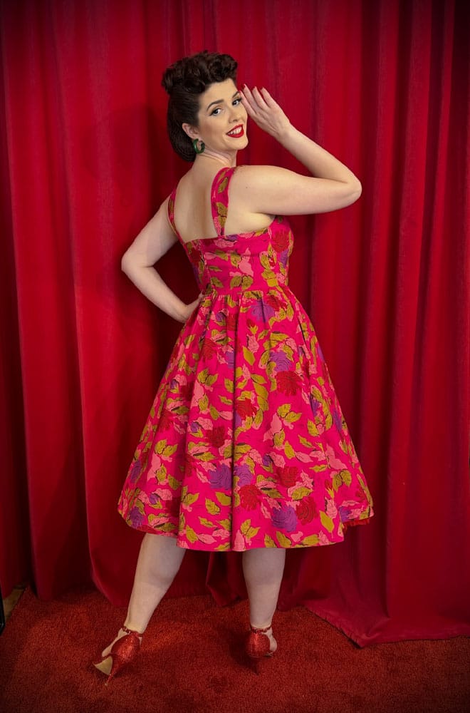 The Anna 1950s Floral Swing Dress is a darling 50s-style summer dress in a sassy floral print. Perfect with a petticoat, ideal for weddings.