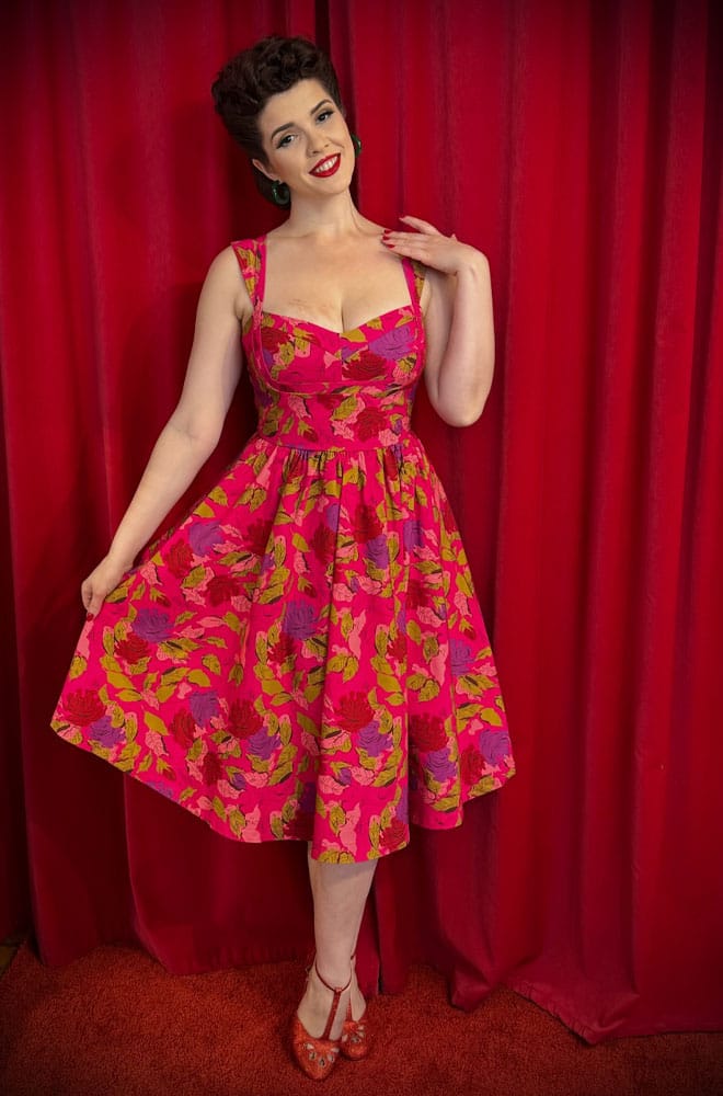 The Anna 1950s Floral Swing Dress is a darling 50s-style summer dress in a sassy floral print. Perfect with a petticoat, ideal for weddings.