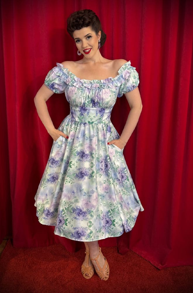 The Watercolour Wildflower Swing Dress is a darling 50s-style summer dress in a romantic floral print. Perfect with a petticoat, ideal for weddings.
