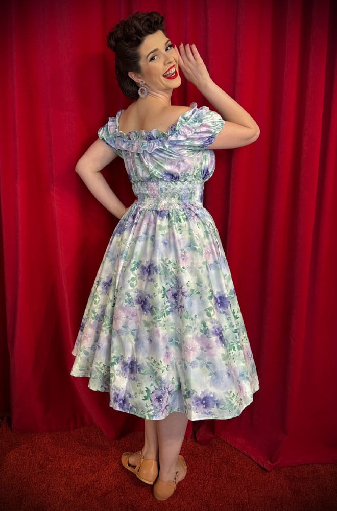 The Watercolour Wildflower Swing Dress is a darling 50s-style summer dress in a romantic floral print. Perfect with a petticoat, ideal for weddings.