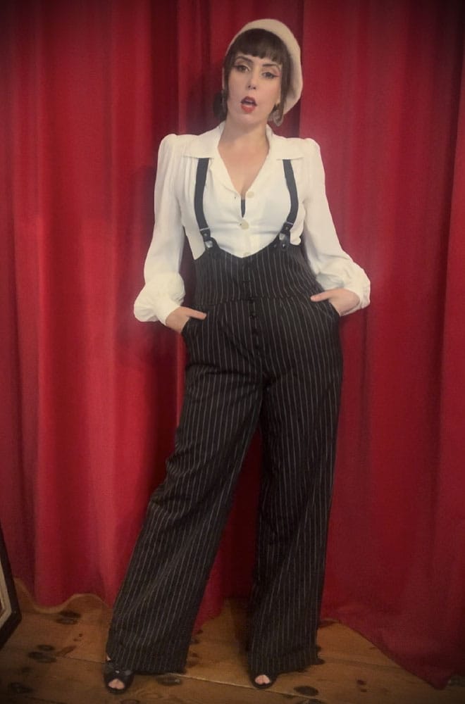 The Black Pinstripe Thelma Trousers are timeless, high-waisted, wide-legged Trousers. We adore the Thirties feel of these and they are oh-so-versatile.