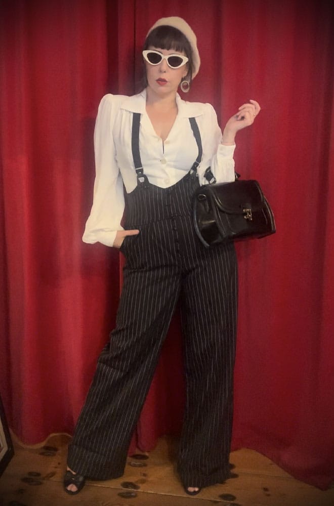 The Black Pinstripe Thelma Trousers are timeless, high-waisted, wide-legged Trousers. We adore the Thirties feel of these and they are oh-so-versatile.