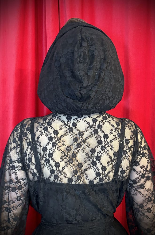Handmade in Somerset, this vintage-inspired Lace Alexandra Hood is cut in Black lace with long, wide straps that tie elegantly beneath your chin