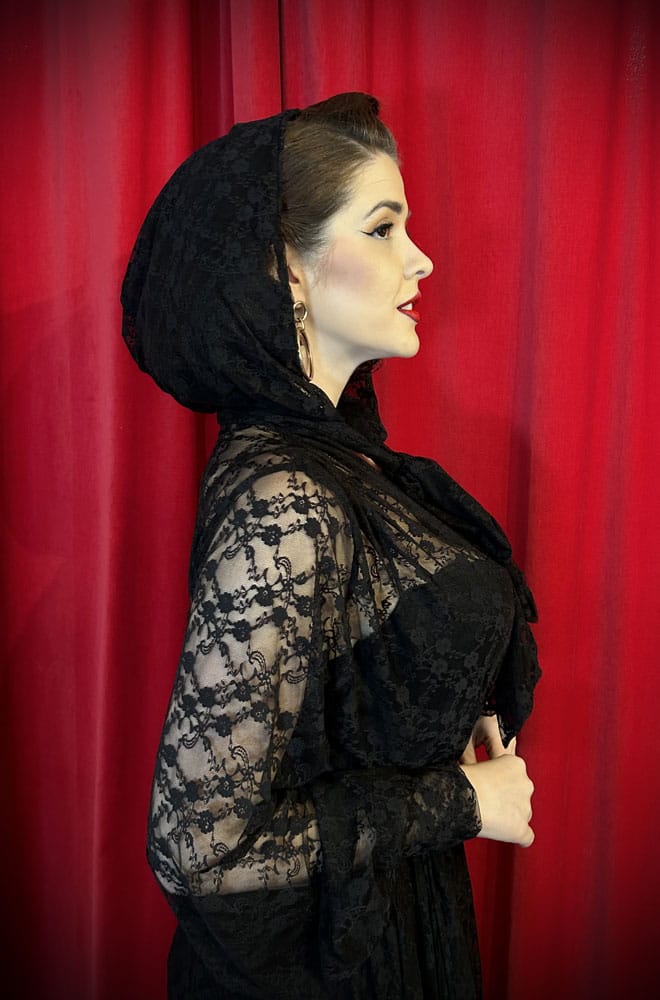Handmade in Somerset, this vintage-inspired Lace Alexandra Hood is cut in Black lace with long, wide straps that tie elegantly beneath your chin