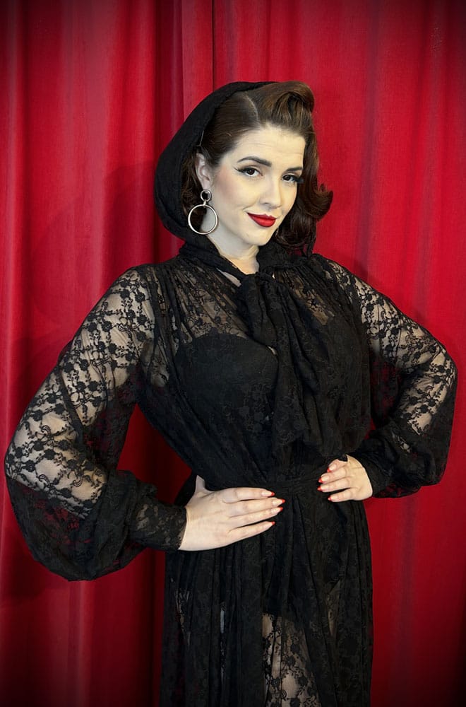 Handmade in Somerset, this vintage-inspired Lace Alexandra Hood is cut in Black lace with long, wide straps that tie elegantly beneath your chin
