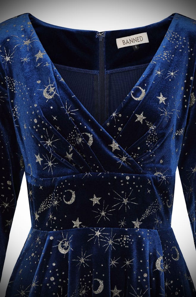 Calling all goddesses! The Celeste Swing Dress is a gorgeous velvet swing dress with a glittering celestial print and pockets!