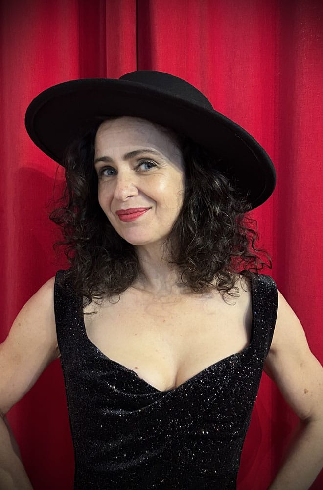 This Midnight Fedora is a striking blend of classic elegance and sass, featuring a timeless fedora silhouette, accented by a bold spike-studded band around the base. 