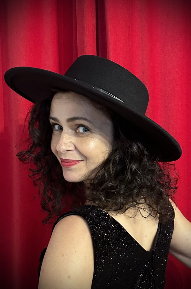 This Midnight Fedora is a striking blend of classic elegance and sass, featuring a timeless fedora silhouette, accented by a bold spike-studded band around the base. 