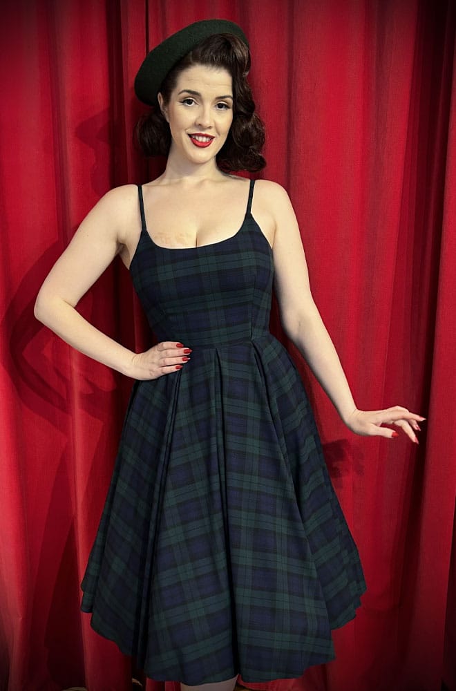 The Stretch Tartan Priscilla Dress in Forest Green by The Pretty Dress Company is perfect for autumn! It is a fresh and fun take on a timeless classic.