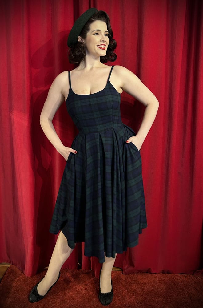 The Stretch Tartan Priscilla Dress in Forest Green by The Pretty Dress Company is perfect for autumn! It is a fresh and fun take on a timeless classic.